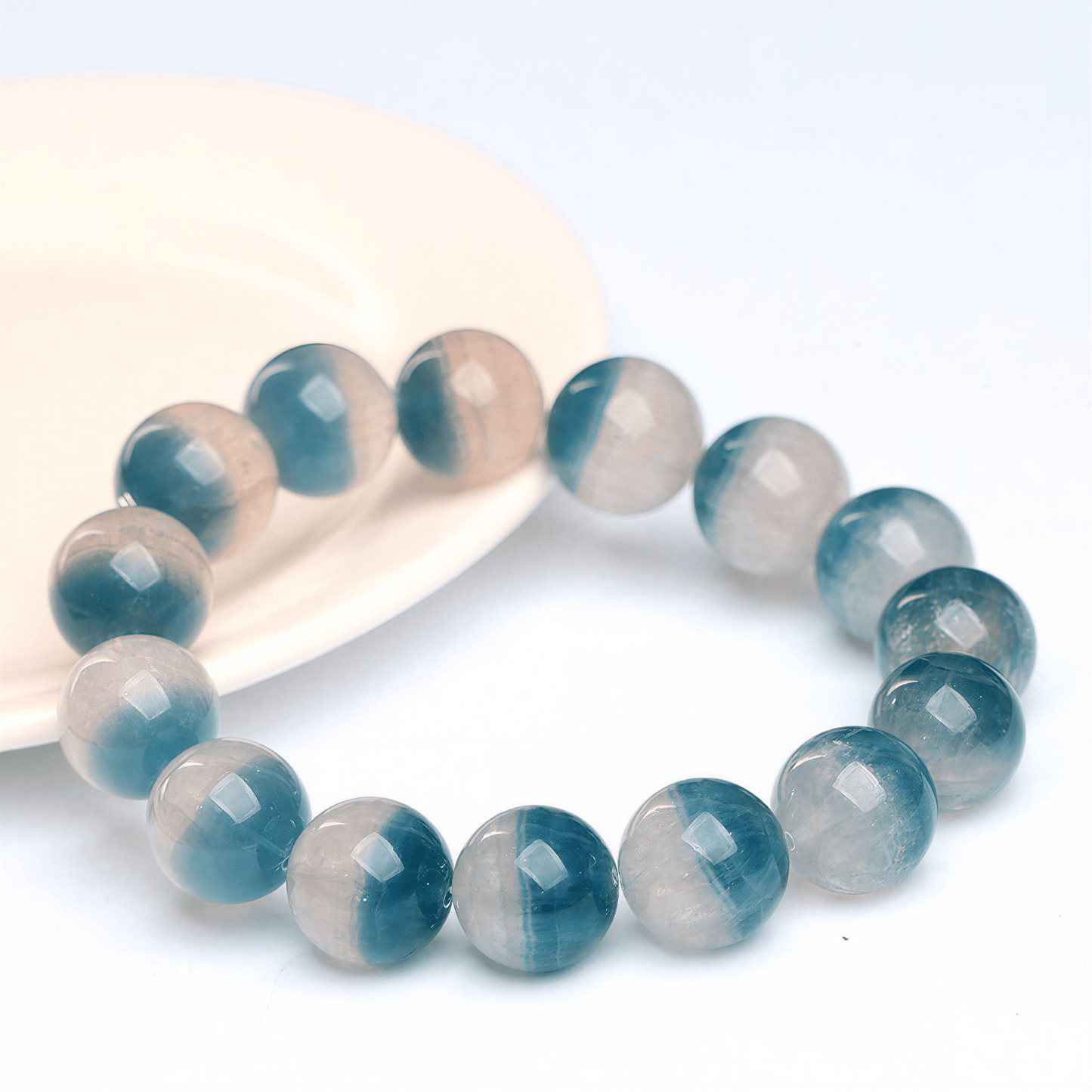 Close-up of Blue Fluorite beads with teal-blue and translucent natural color zoning