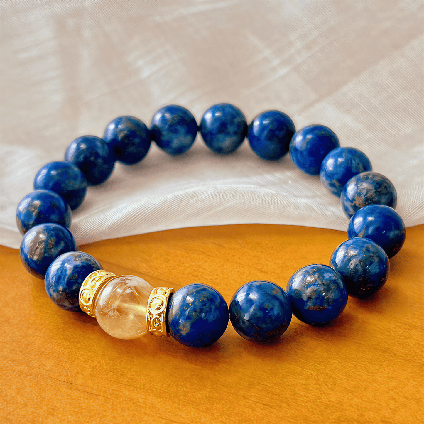 Close-up of Lapis Lazuli beads with natural Citrine focal bead and patterned gold-tone spacers