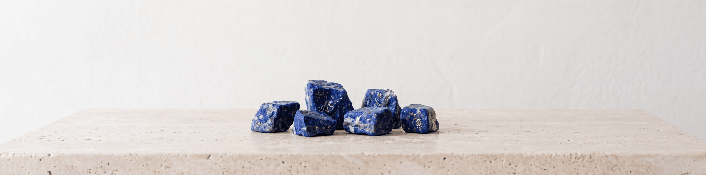 Raw lapis lazuli crystals with deep blue color and gold flecks for a gemstone bracelet collection