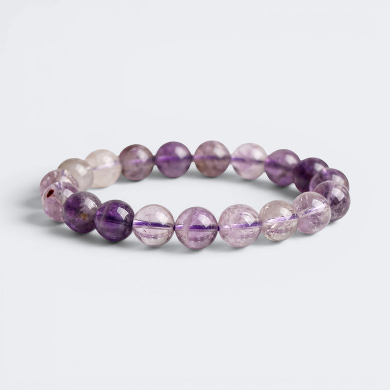 Front view of A Quiet Return bracelet with 10mm natural Amethyst beads in lavender and violet tones