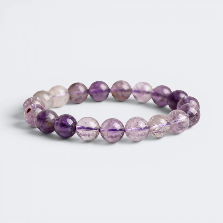 Front view of A Quiet Return bracelet with 10mm natural Amethyst beads in lavender and violet tones