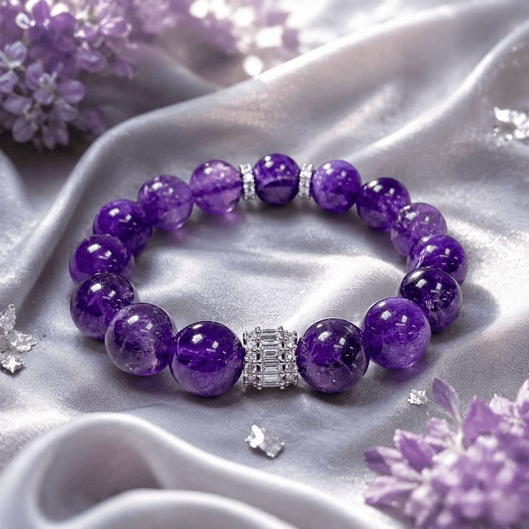 A Still Mind bracelet displayed on lavender satin with deep purple Amethyst beads