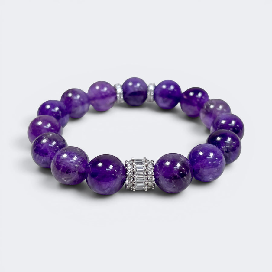 Front view of A Still Mind bracelet with 12mm natural Amethyst beads and silver-tone rectangular accent