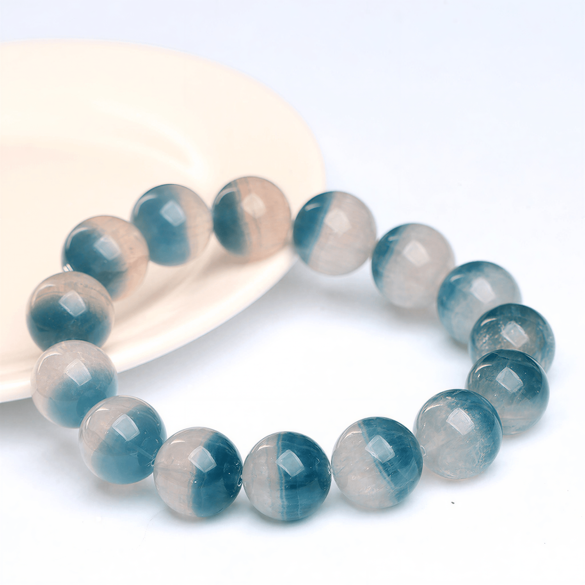 Close-up of Blue Fluorite beads with teal-blue and translucent natural color zoning