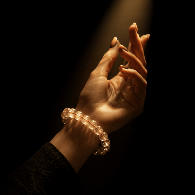 Golden Rutilated Quartz bracelet glowing under warm light on the wrist