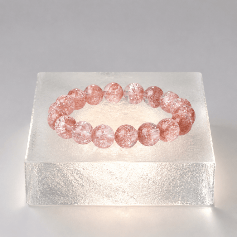 Good Things Find Me Pink Super Seven crystal bracelet displayed on a glowing ice-like block