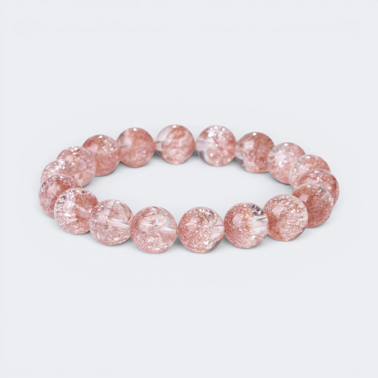 Front view of Good Things Find Me bracelet with 10mm 7A Pink Smoky Super Seven crystal beads and golden inclusions