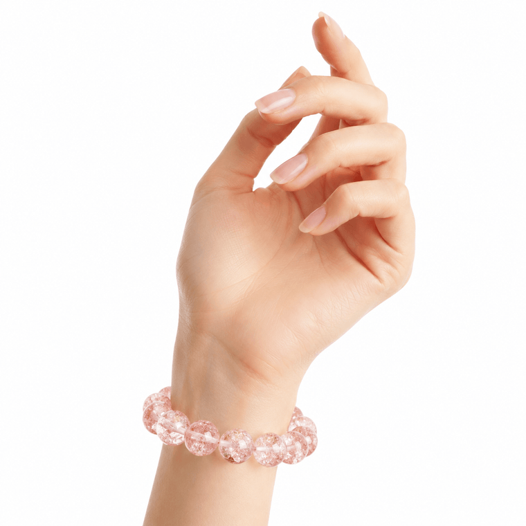Woman wearing Good Things Find Me 10mm Pink Super Seven crystal bracelet on a clean white background