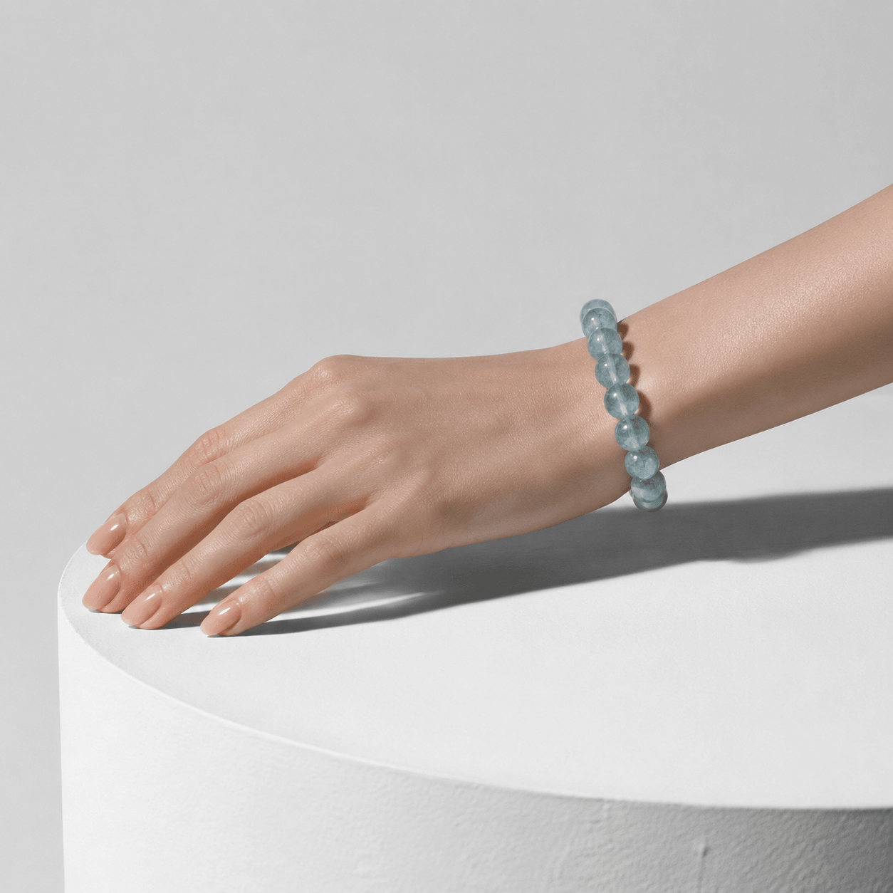 Translucent Green Fluorite bracelet worn in a minimalist sunlit setting