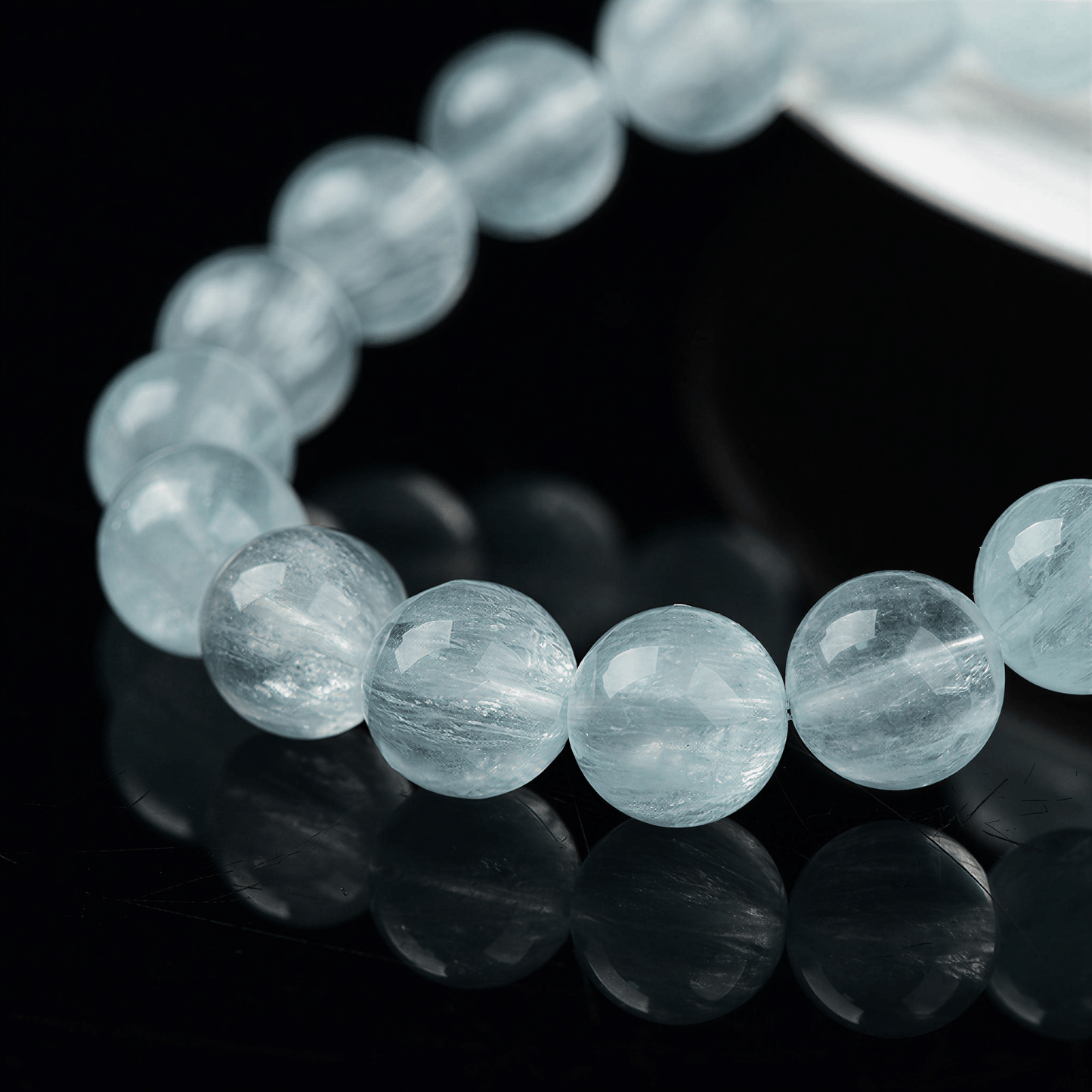 Close-up of natural Green Fluorite beads with fine thread-like internal inclusions