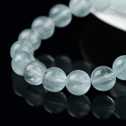 Close-up of natural Green Fluorite beads with fine thread-like internal inclusions