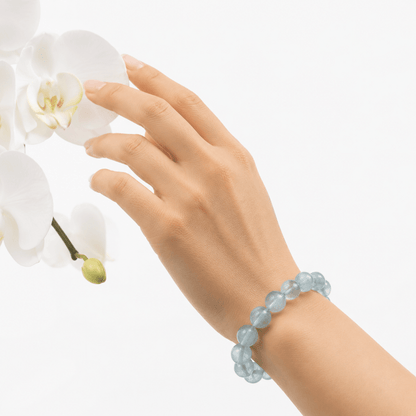 Natural Green Fluorite bracelet worn beside delicate white orchids