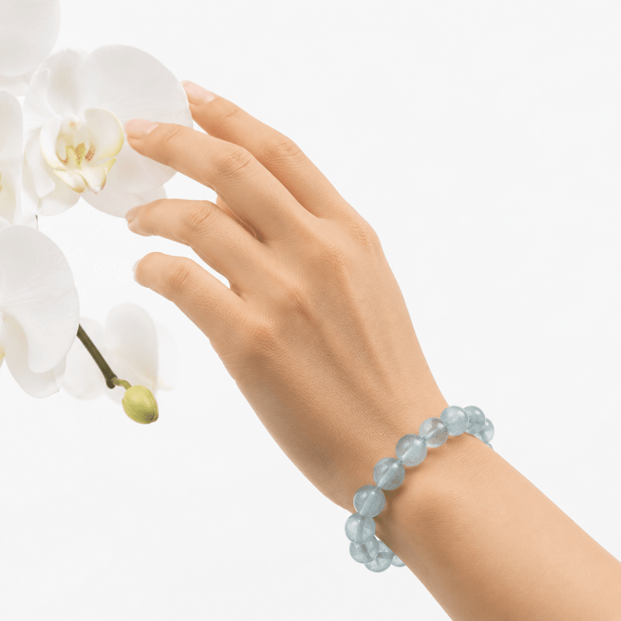 Natural Green Fluorite bracelet worn beside delicate white orchids