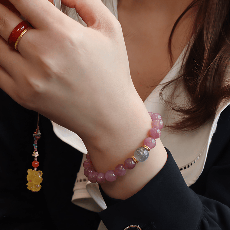 Held by the Moon Purple Mica Rose Quartz bracelet worn with elegant black and white outfit