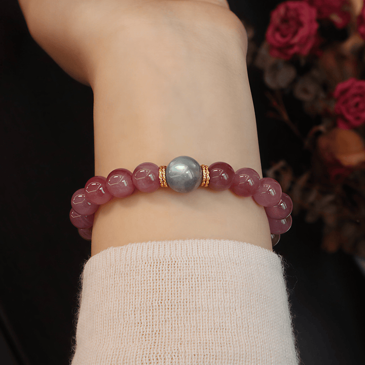 Woman wearing Held by the Moon bracelet with Gray Moonstone focal bead and gold-tone spacer accents