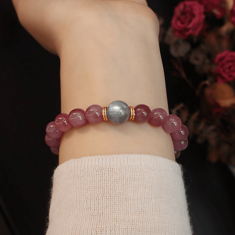 Woman wearing Held by the Moon bracelet with Gray Moonstone focal bead and gold-tone spacer accents