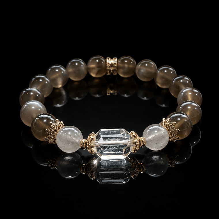 Gray Moonstone bracelet with faceted Clear Quartz focal bead displayed on black reflective surface
