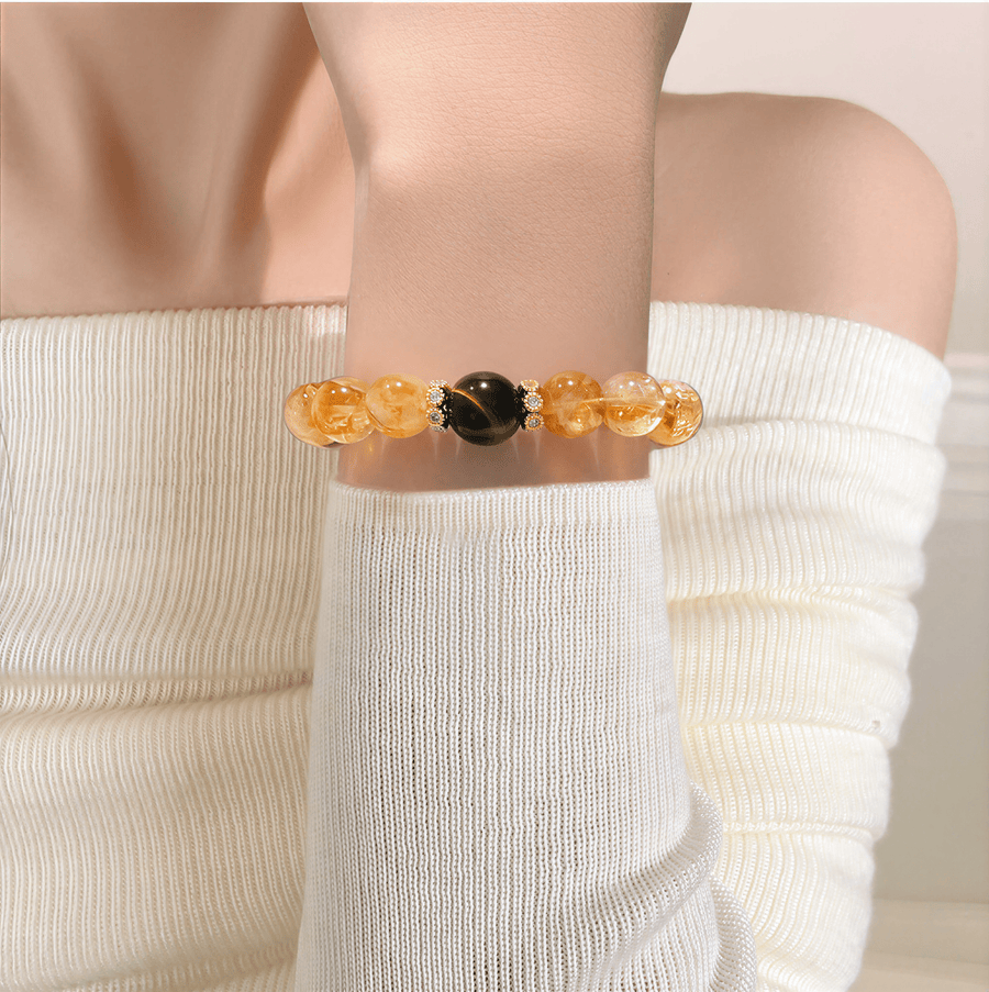 I Am Ready Citrine and Tiger Eye bracelet worn with white knit outfit in warm light