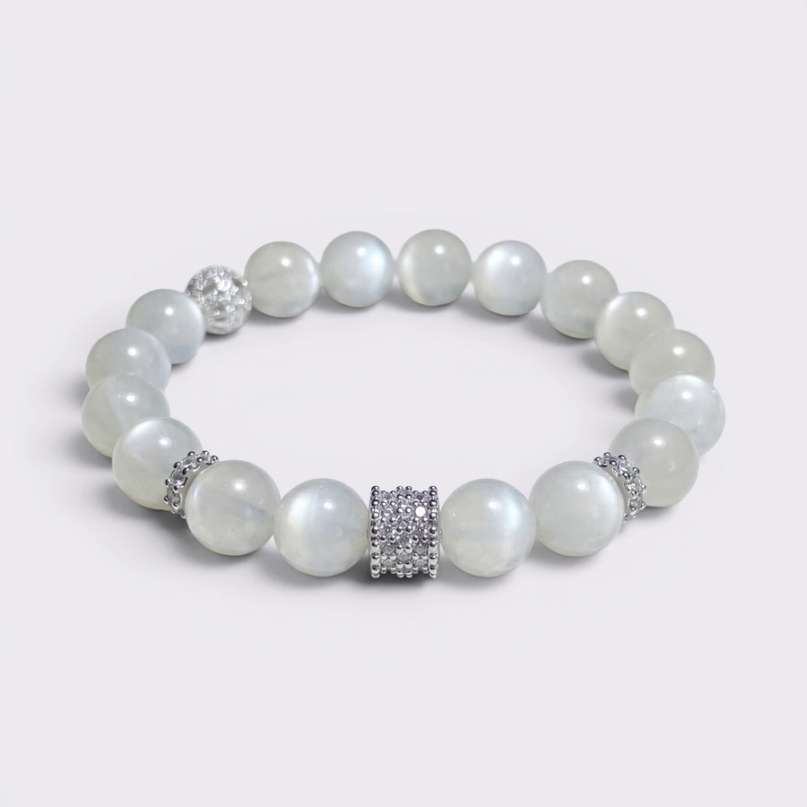 Front view of I Am Softly Held bracelet with 10mm natural Moonstone beads and silver-tone textured spacer accents