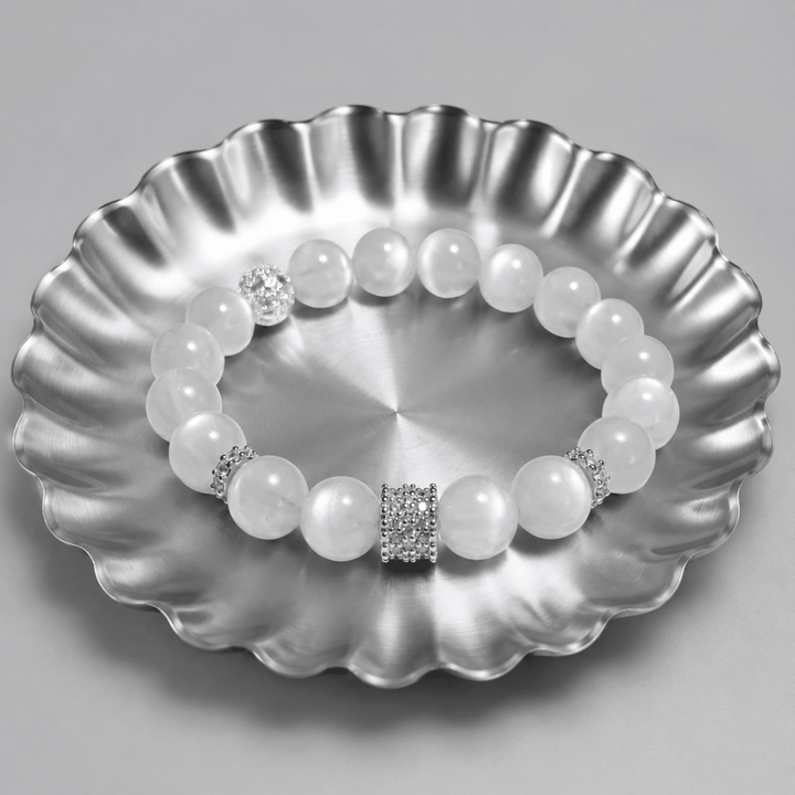 Natural Moonstone bracelet displayed on a silver scalloped tray with textured spacer accents