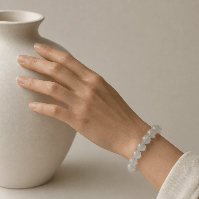 White Moonstone bracelet displayed inside a luminous shell with soft pearl-like texture