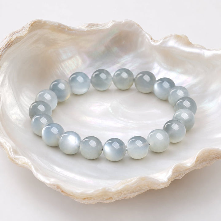 White Moonstone bracelet displayed inside a luminous shell with soft pearl-like texture
