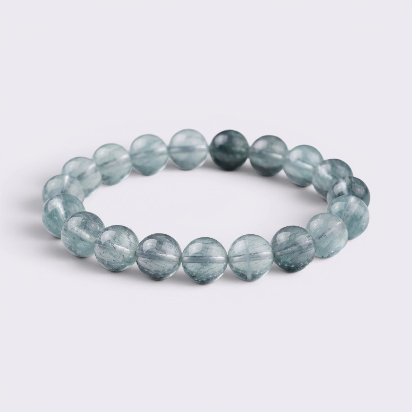Natural 12mm Green Fluorite bracelet with translucent aqua beads and thread-like inclusions
