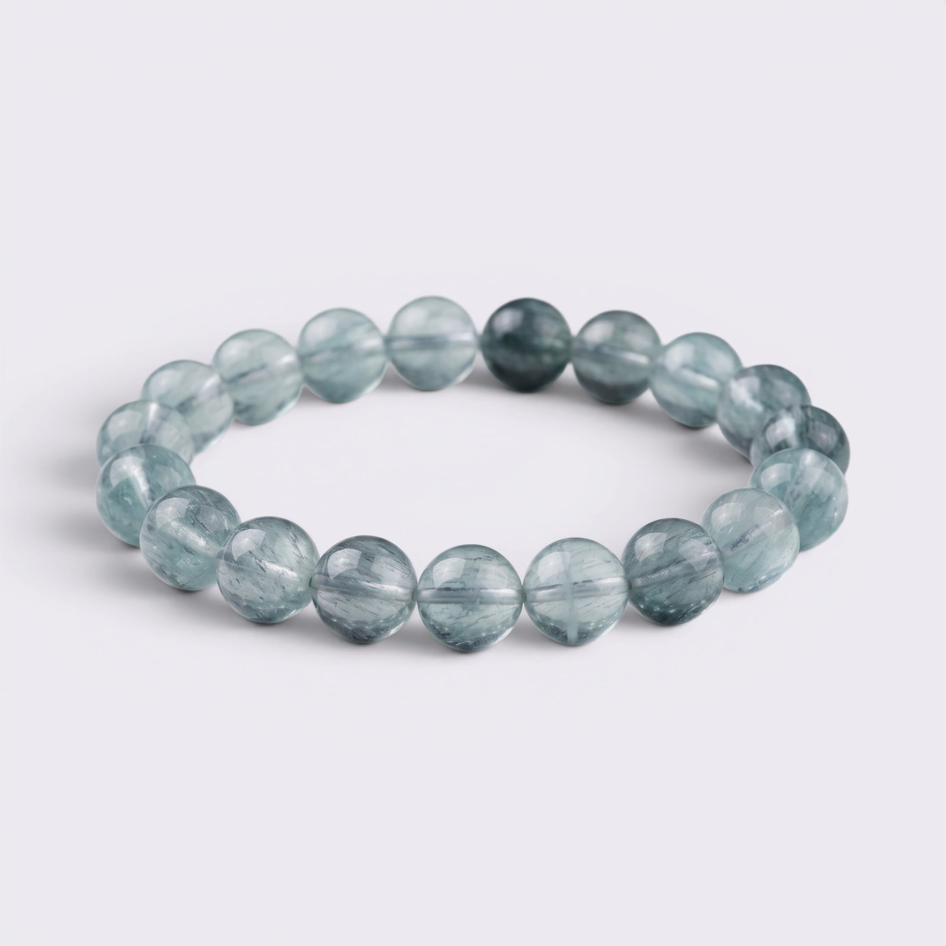 Natural 12mm Green Fluorite bracelet with translucent aqua beads and thread-like inclusions