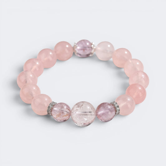 Front view of I Let Love In bracelet with 12mm natural Mozambique Rose Quartz beads and Amethyst accents