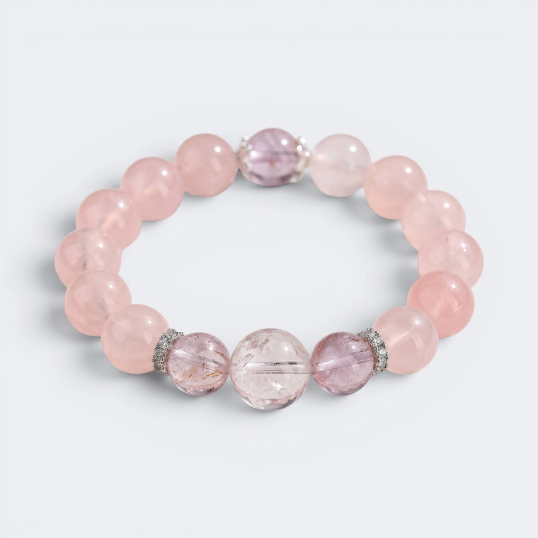Front view of I Let Love In bracelet with 12mm natural Mozambique Rose Quartz beads and Amethyst accents