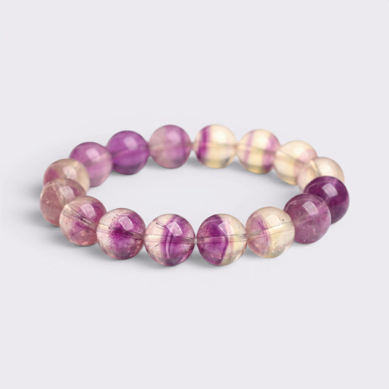 Natural 14mm Purple Fluorite bracelet with violet, clear, and pale-golden color-zoned beads