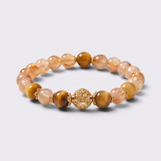 Front view of I Move With Courage bracelet with 8.8mm Yellow Pyramid Citrine beads, Tiger's Eye accents, and gold-tone focal bead