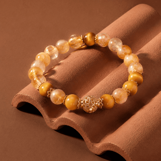 Citrine and Tiger's Eye bracelet displayed on terracotta tile in warm sunlight