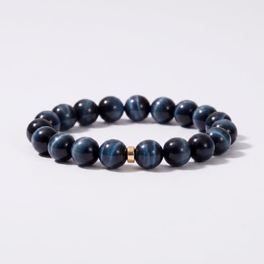 Front view of I Stand Steady bracelet with 10mm natural Blue Tiger's Eye beads and gold-tone spacer accent