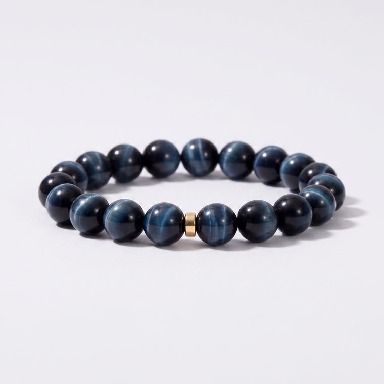 Front view of I Stand Steady bracelet with 10mm natural Blue Tiger's Eye beads and gold-tone spacer accent