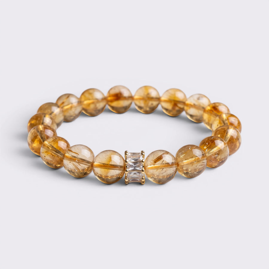 Front view of I Welcome More bracelet with 10mm natural Citrine beads and clear crystal focal accent