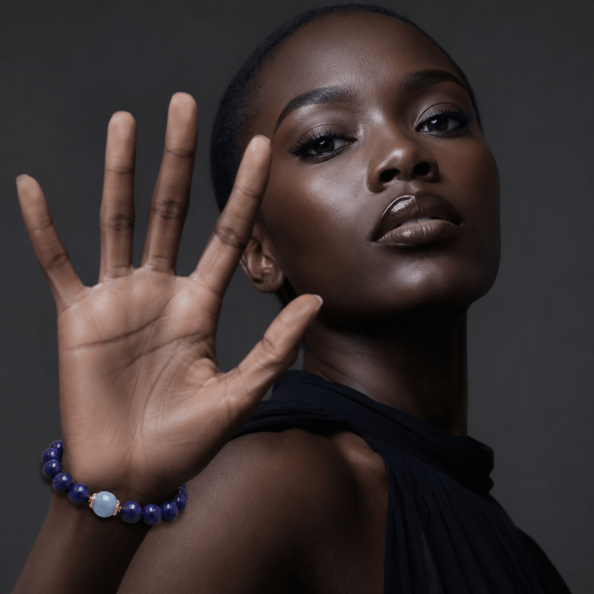 Lapis Lazuli bracelet with Aquamarine focal bead shown on model wrist