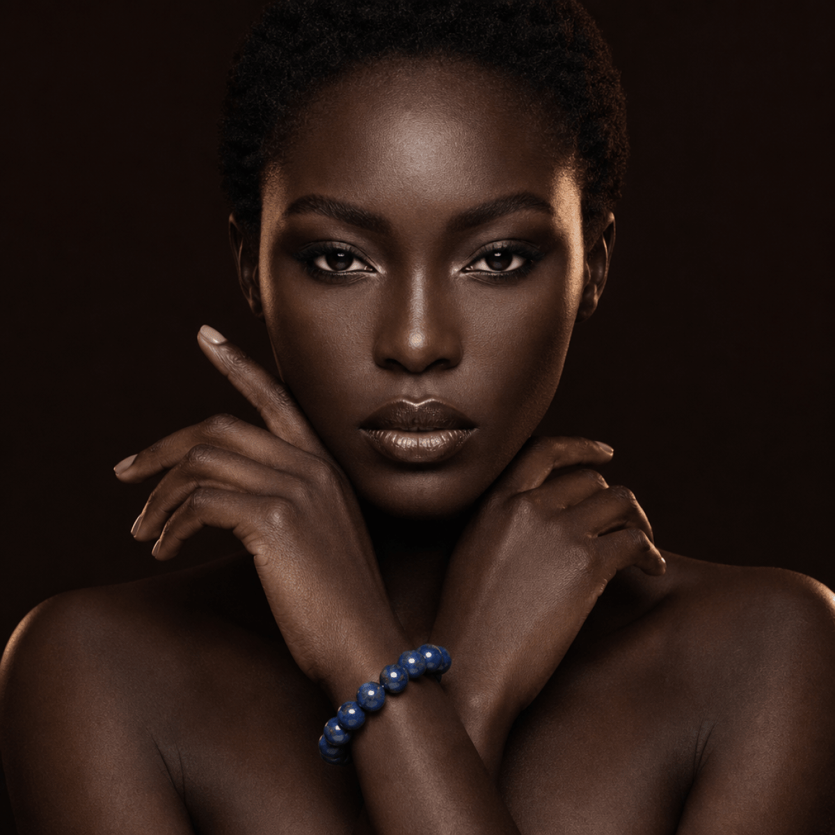 Lapis Lazuli bracelet styled in a dramatic dark editorial portrait
