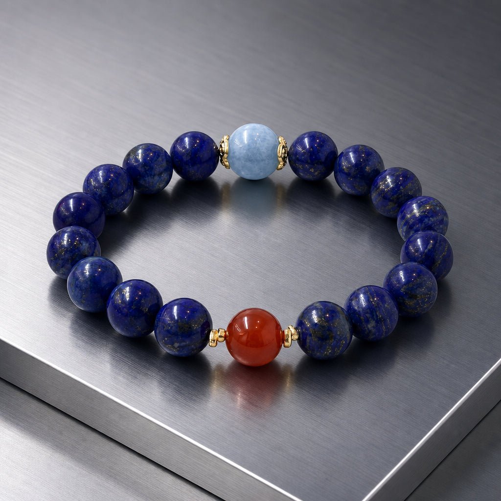 Lapis Lazuli beaded bracelet with red Nanhong Agate and pale blue Aquamarine on metal display