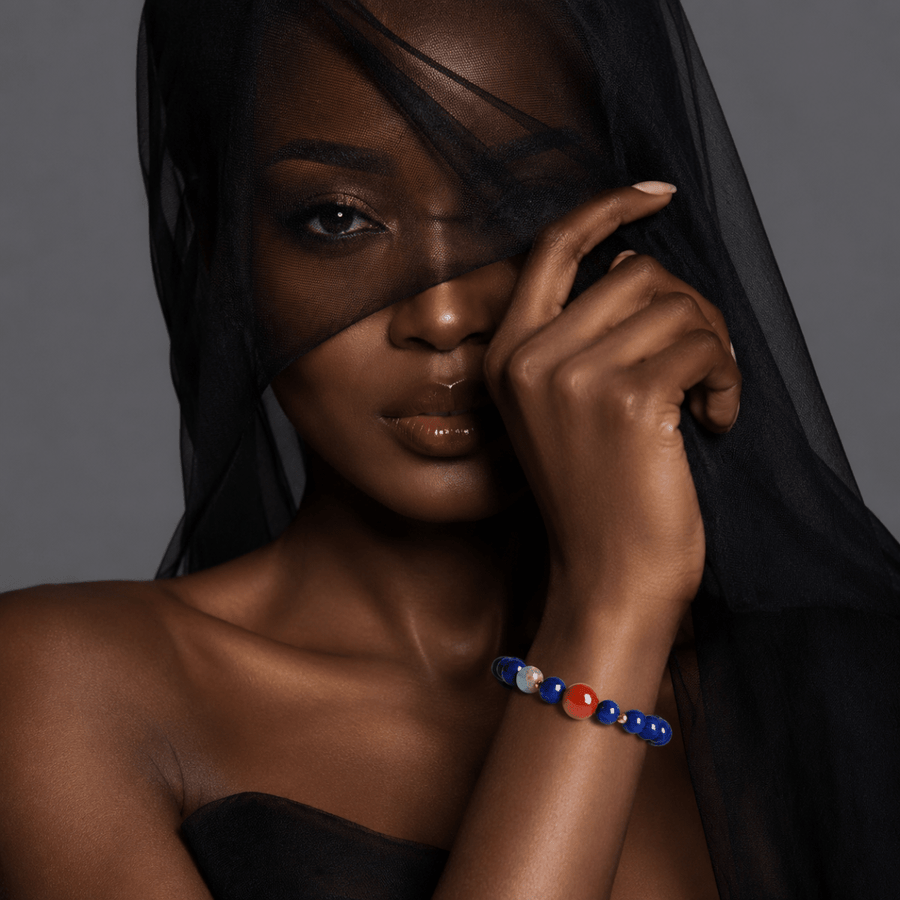 Lapis Lazuli bracelet with Nanhong focal bead shown on model in black styling