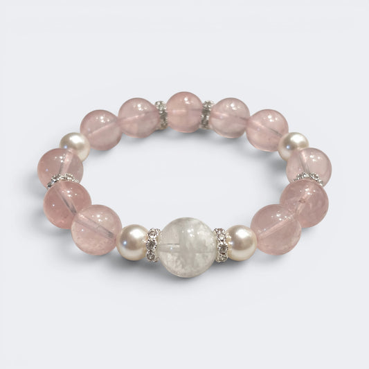 Front view of Love Lives Here bracelet with 10mm natural Rose Quartz beads and Snowflake Phantom centerpiece
