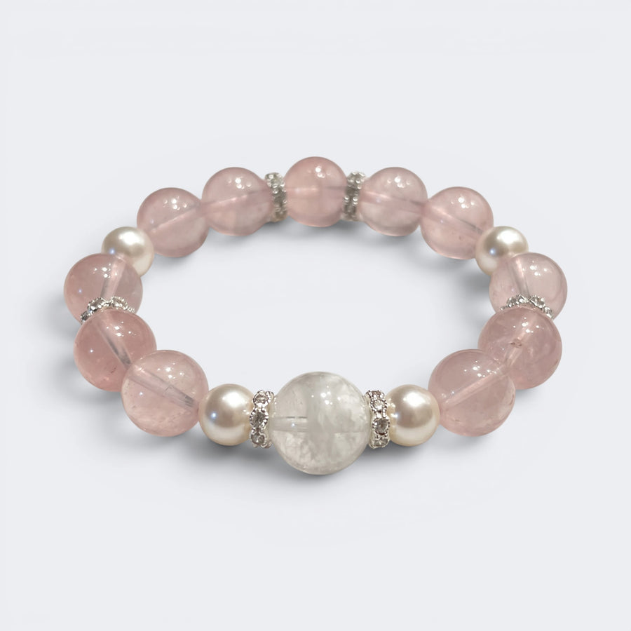 Front view of Love Lives Here bracelet with 10mm natural Rose Quartz beads and Snowflake Phantom centerpiece