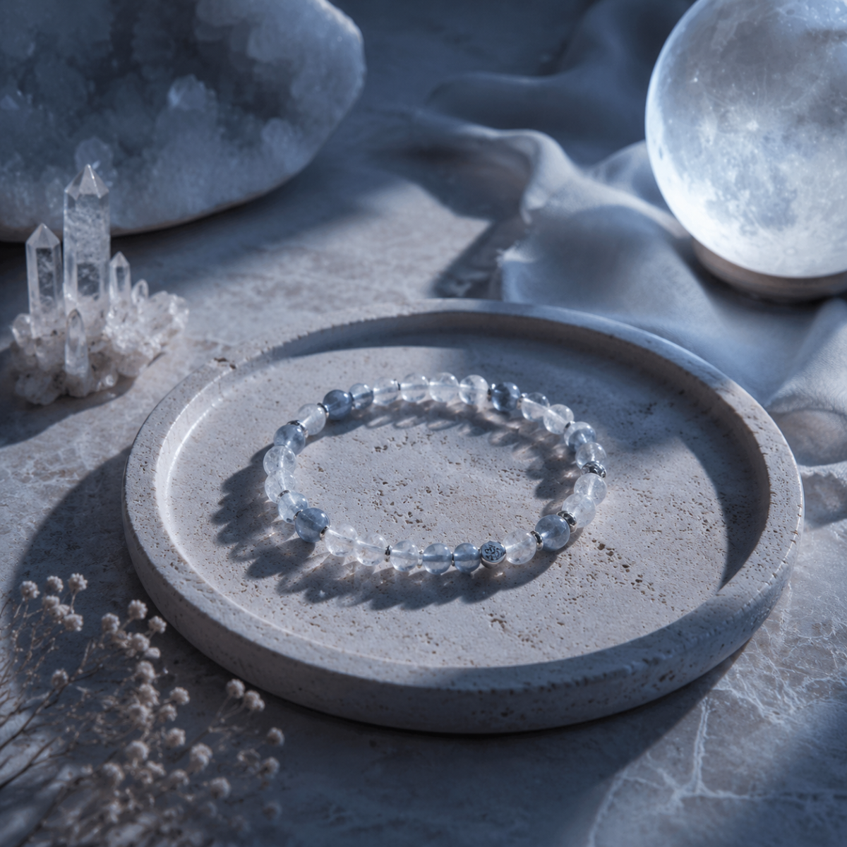 Crystal bracelet resting on a tray under moonlight for a gentle cleansing ritual