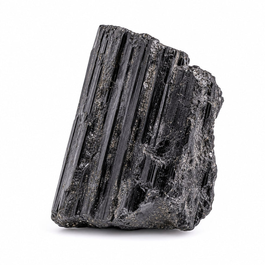 Raw black tourmaline crystal with natural vertical striations on a white background