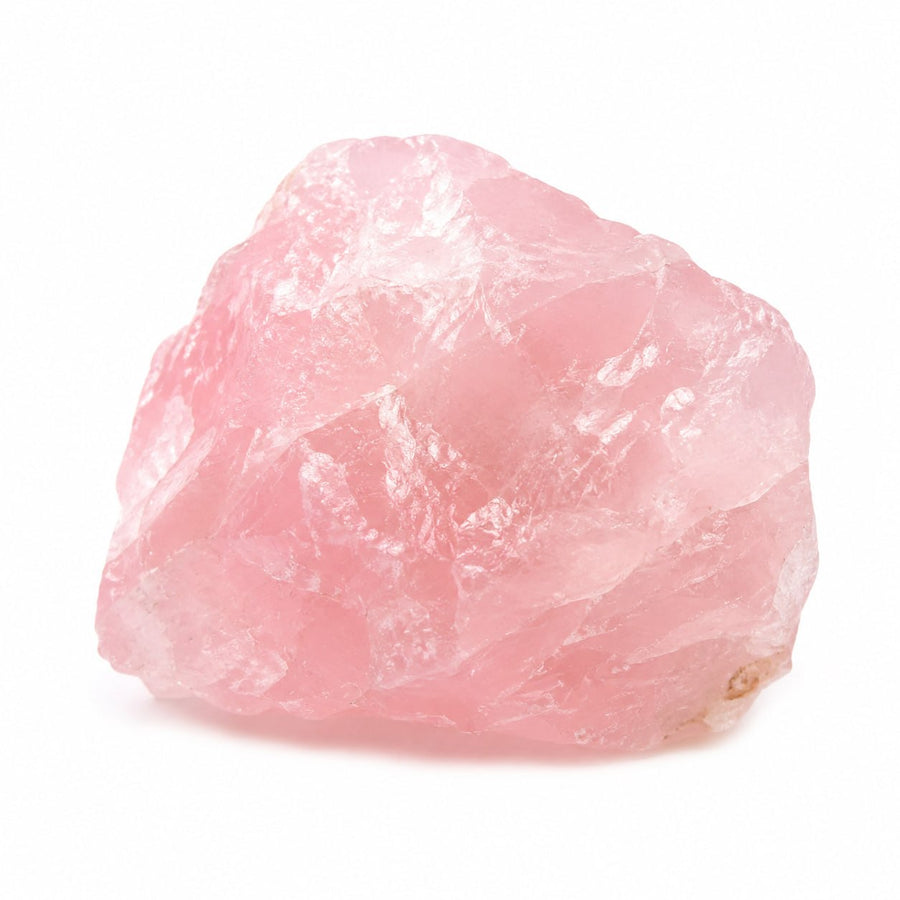 Raw rose quartz crystal on a white background