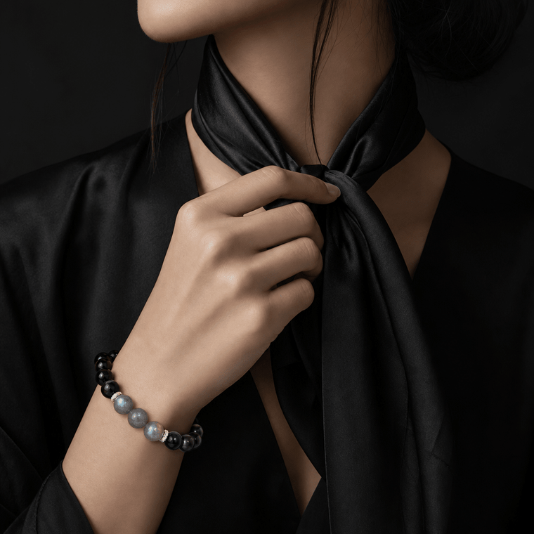 My Energy Is Mine bracelet styled with black scarf and elegant dark outfit