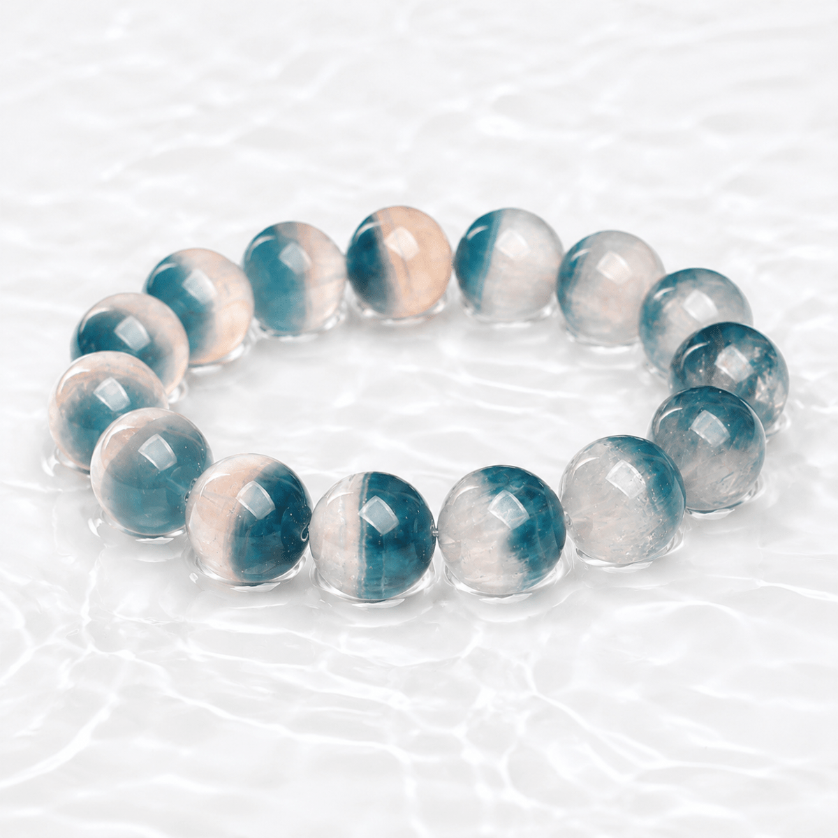 Natural Blue Fluorite bracelet displayed on a luminous white water-textured surface