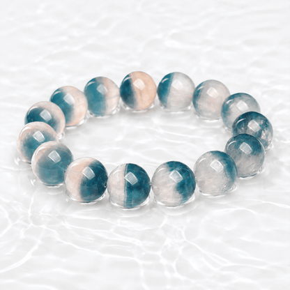 Natural Blue Fluorite bracelet displayed on a luminous white water-textured surface