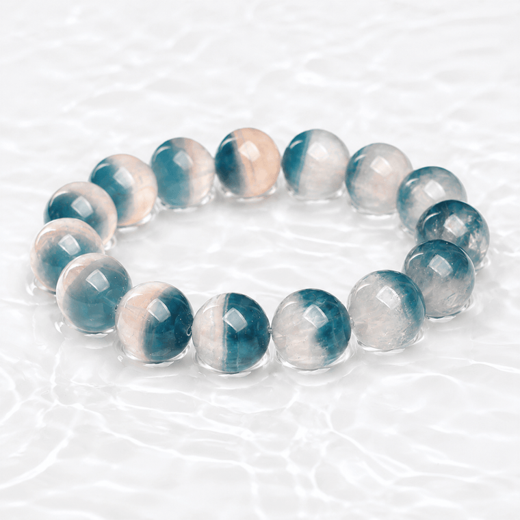 Natural Blue Fluorite bracelet displayed on a luminous white water-textured surface