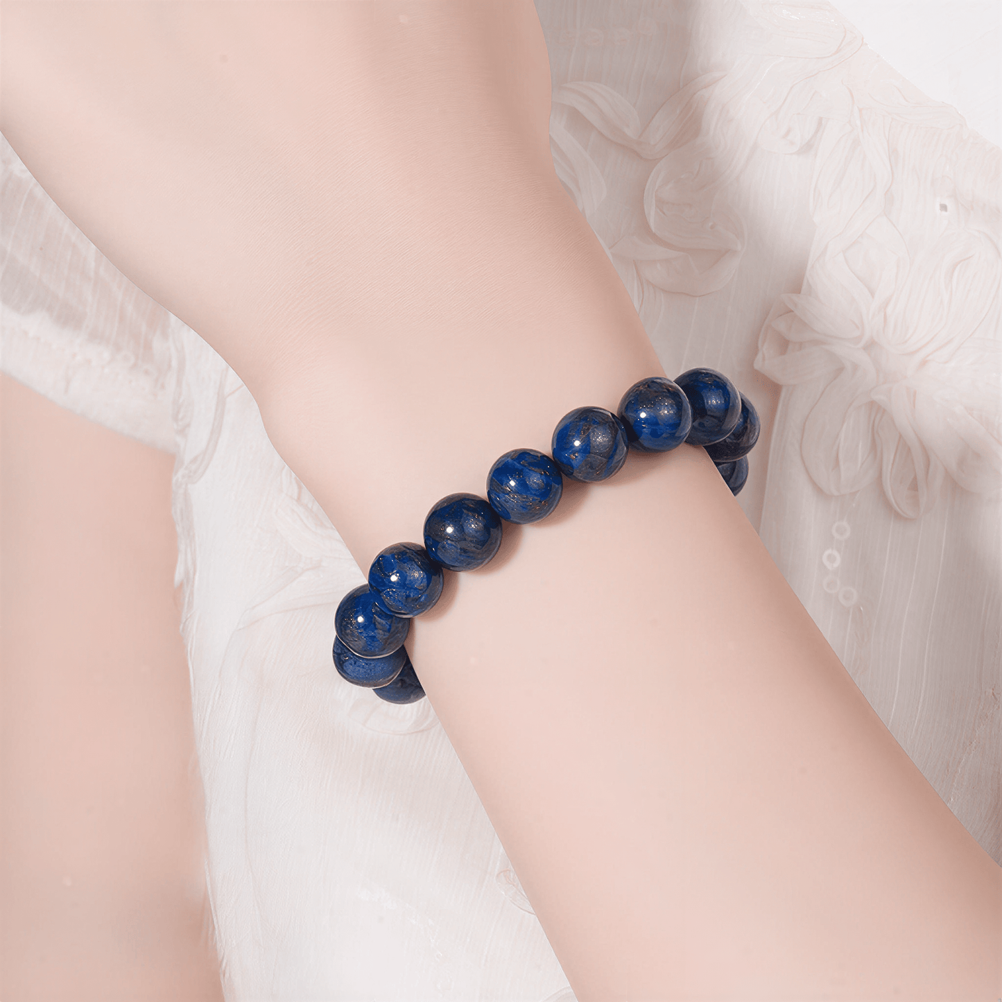 Natural blue Lapis Lazuli bracelet styled with a soft white outfit